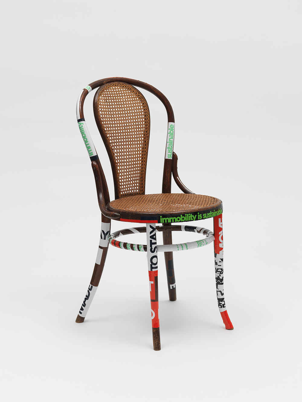 Product image: Wooden Chair, modified by Vasso & Evi, claim stickers, 2022 Athens, 4.6 tons